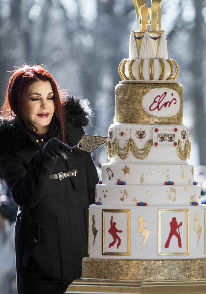 Priscilla Presley cuts the eight-tiered birthday cake during the 80th birthday celebration for her late ex-husband, Elvis Presley, on Jan. 8 at Graceland in Memphis, Tenn.