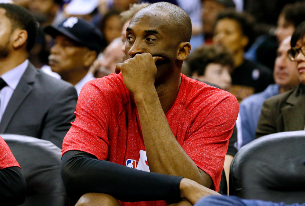 Los Angeles Lakers guard Kobe Bryant sits on the bench during Wednesday’s game in New Orleans. Bryant tore his right rotator cuff in the game and will likely miss the rest of this season after having surgery this week.