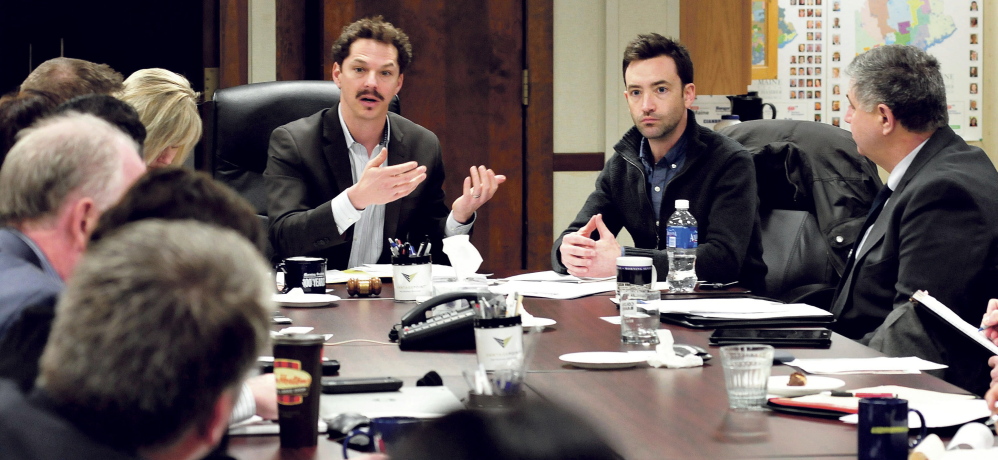 Sen. Justin Alfond, left, and Patrick Roche of Think Tank Coworking discuss ways to create co-location work spaces Monday at Mid Maine Chamber of Commerce in Waterville.