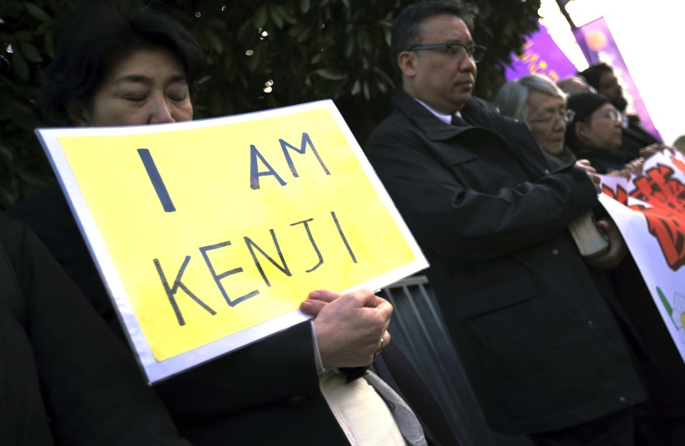Protesters chant “Free Goto” during a demonstration in front of the Prime Minister’s Official residence in Tokyo, Tuesday.