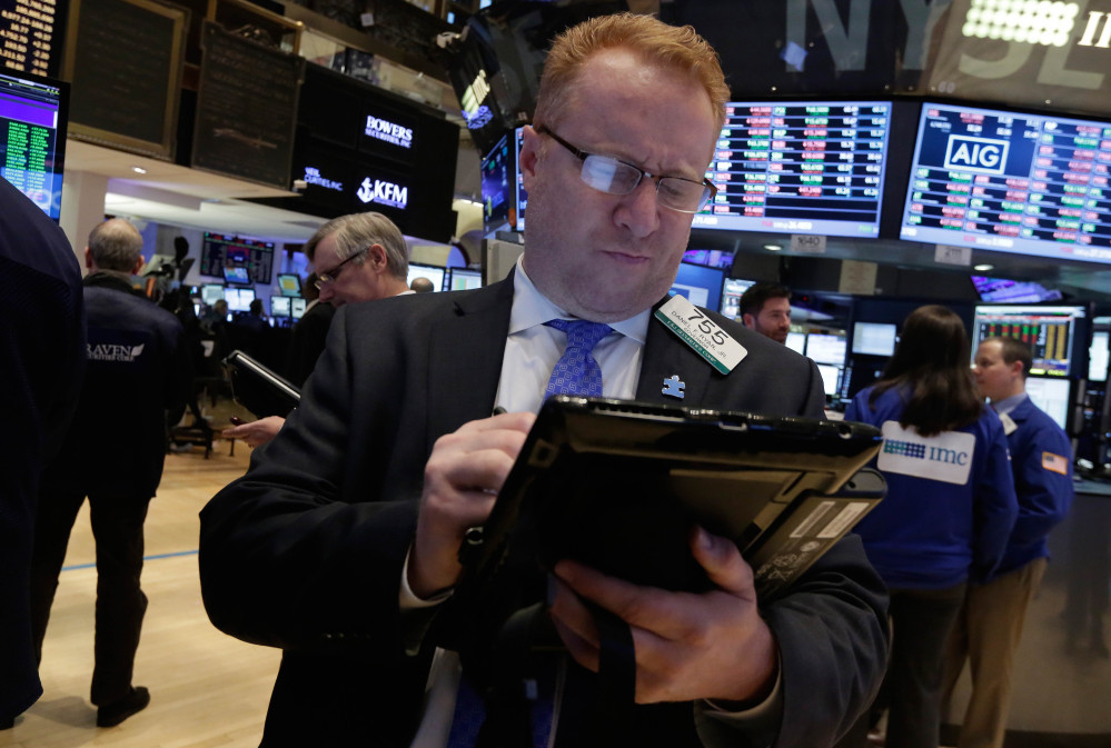 Trader Daniel Ryan works on the floor of the New York Stock Exchange Friday.