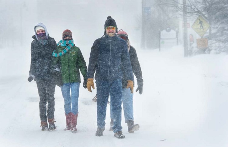 Jack Milton/Systems Editor
Molly, Maeve, Christian and Tandy Ratliff walk home on Ocean Street in South Portland after having breakfast at a local coffee shop during the blizzard Tuesday.