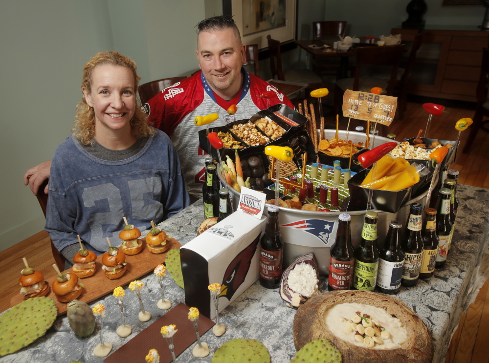 Brian and Shanna O’Hea’s snack stadium includes regional items like clam chowder and salmon sliders to represent New England and Seattle, the opposing teams.