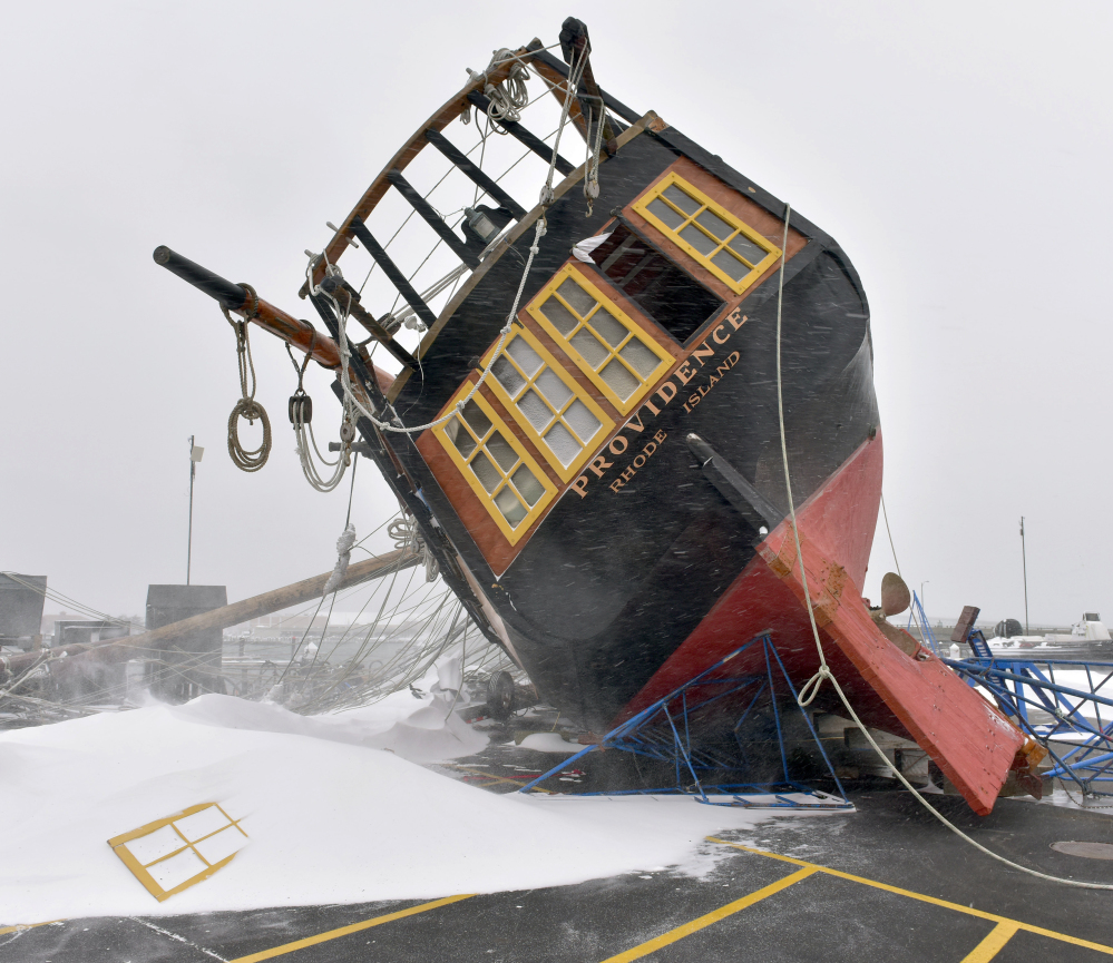 Newport, R.I., took the full brunt of a blizzard, which toppled the tall ship replica of the USS Providence on the dock, breaking the mast and puncturing the hull, in 2015.