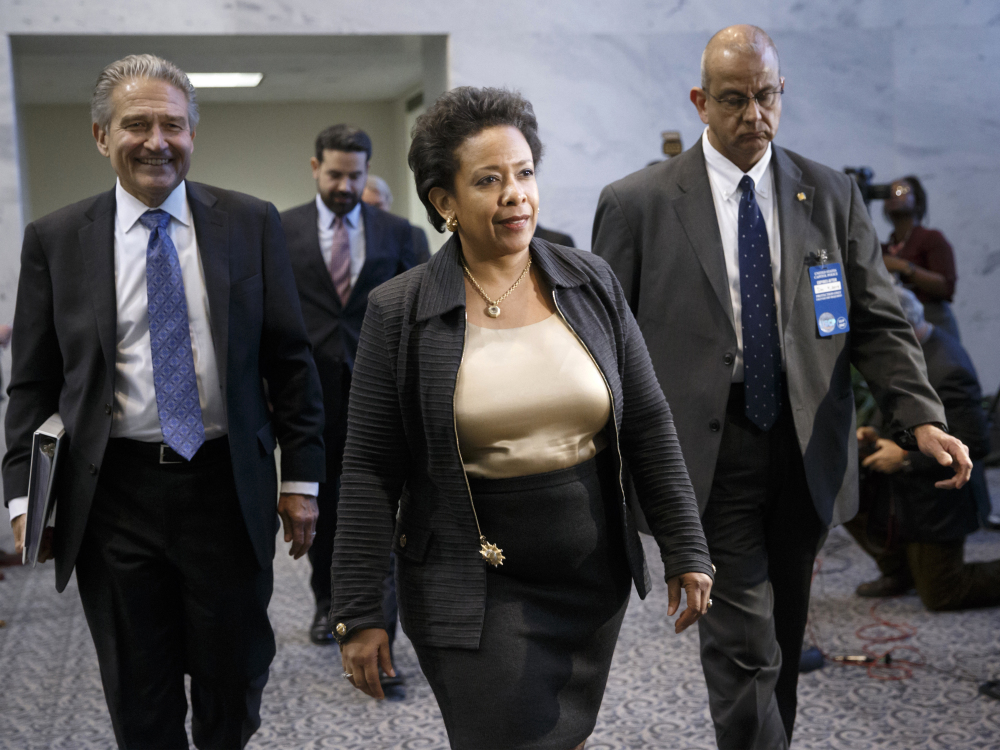 In this Dec. 2, 2014 file photo, Attorney General nominee Loretta Lynch arrives for a meeting with fellow New Yorker, Sen. Charles Schumer, D-N.Y., on Capitol Hill in Washington.
