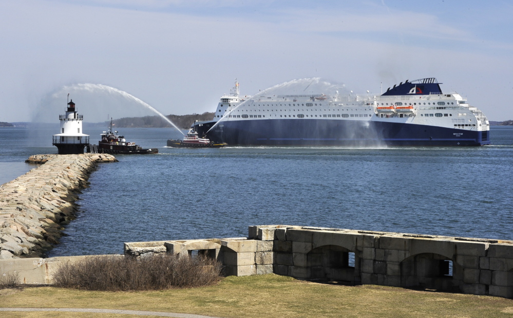 The Nova Scotia government will announce its plans next week for the future of the Nova Star ferry, shown here in Portland harbor passing Spring Point Light in South Portland while a tugboat sprays a welcome.