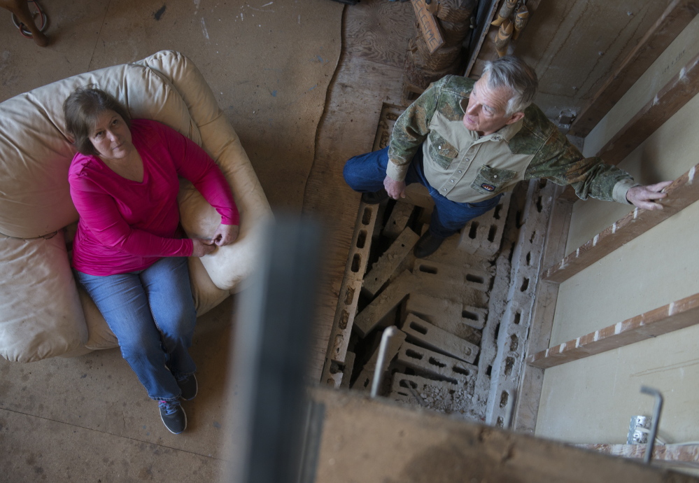 Sandra Ladra and her husband, Gary, stand where their 28-foot-tall stone fireplace used to be. An intraplate earthquake in Prague, Okla., measuring a record 5.6 caused it to crumble on Nov. 5, 2011. Washington Post photo by Linda Davidson