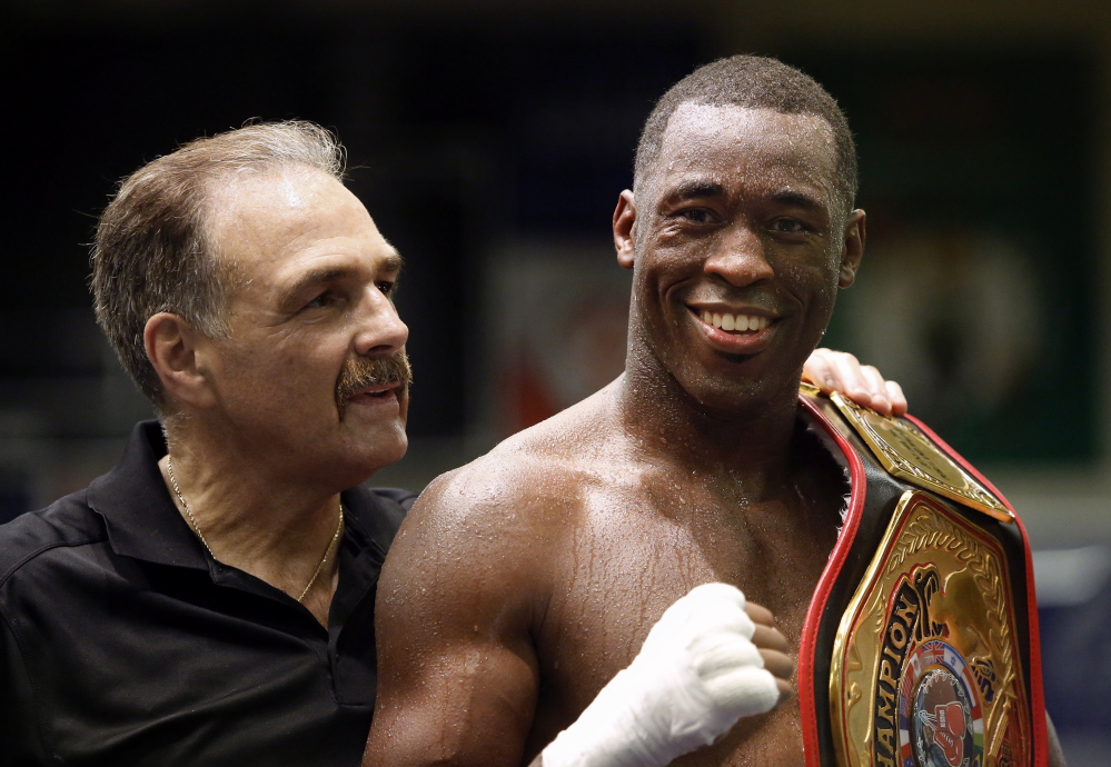 Russell Lamour, right, with Portland Boxing Club coach Bob Russo. 2014 File Photo/Derek Davis