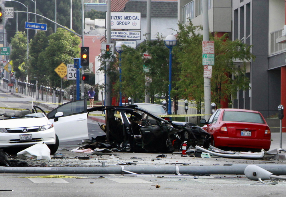 A street is closed after a car crash in West Hollywood, Calif., on July 4. The chances of dying in a crash in a late-model car or light truck fell by more than a third over three years.