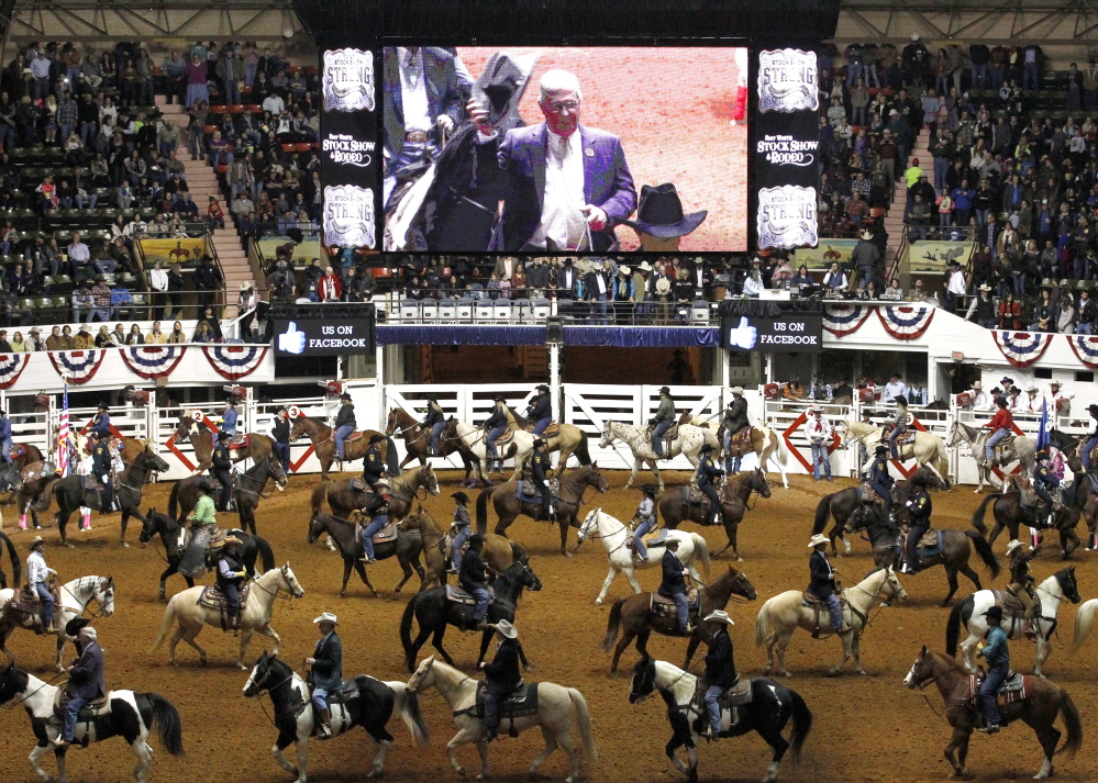 Riders come into the Fort Worth Stock Show & Rodeo on Friday for the Grand Entry. The event has long featured a Christian flavor, but this year a Muslim imam led prayers.