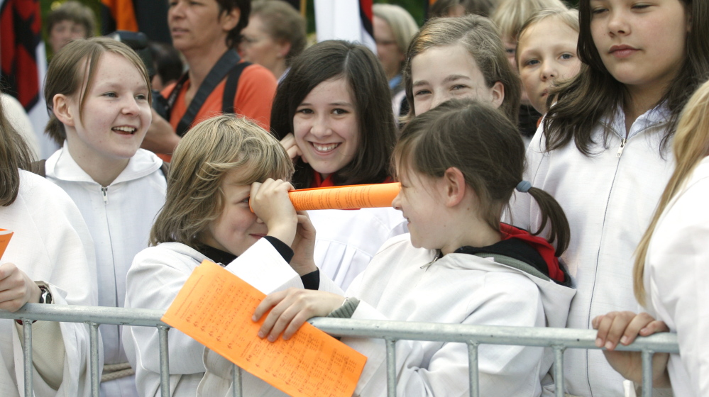 Altar girls joke with each other as they wait for a Mass at the 97th German Catholic Conference in Osnabrueck in 2008. The priest at a Roman Catholic church in San Francisco has prohibited girls from becoming altar servers.