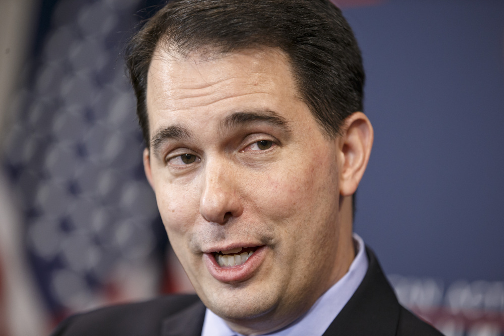 Wisconsin Gov. Scott Walker speaks at the American Action Forum in Washington on Thursday. Walker is expanding his political operation as he fights for early momentum in the crowded field of prospective Republican presidential candidates.