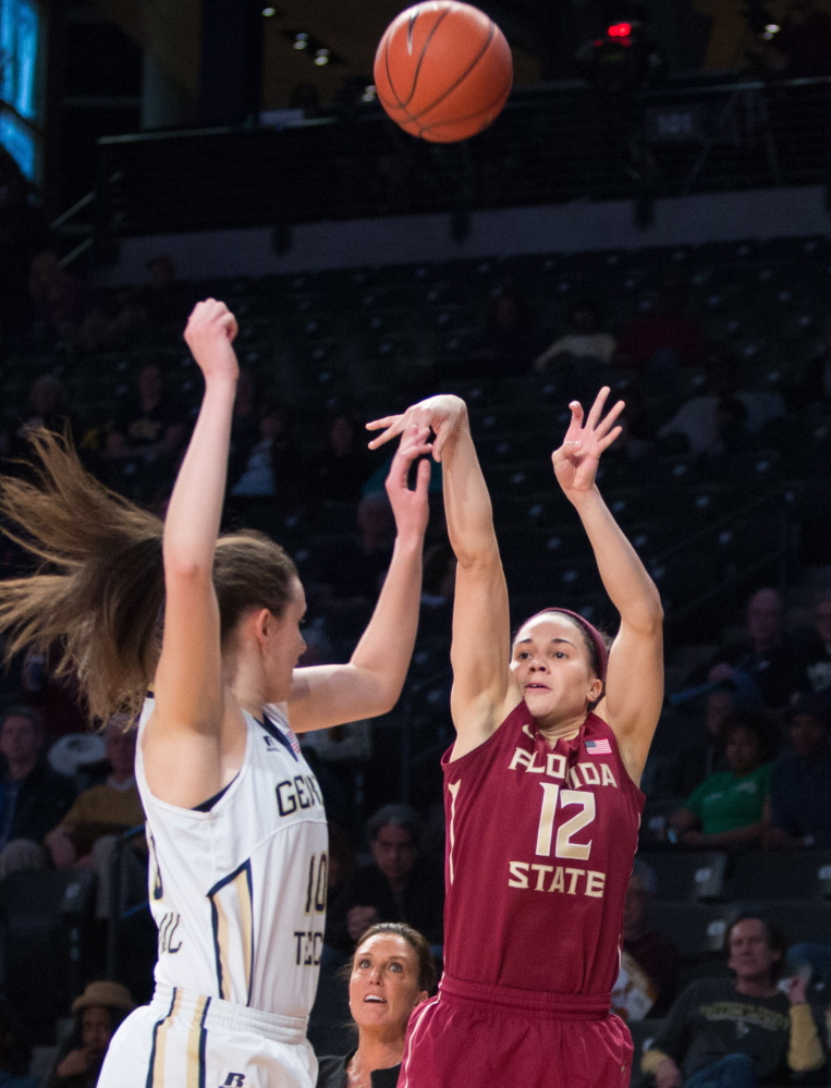 Brittany Brown of Florida State shoots a 3-pointer over Georgia Tech’s Katarina Vuckovic during the first half of their Atlantic Coast Conference game Friday in Atlanta. Ninth-ranked Florida State won, 82-62.