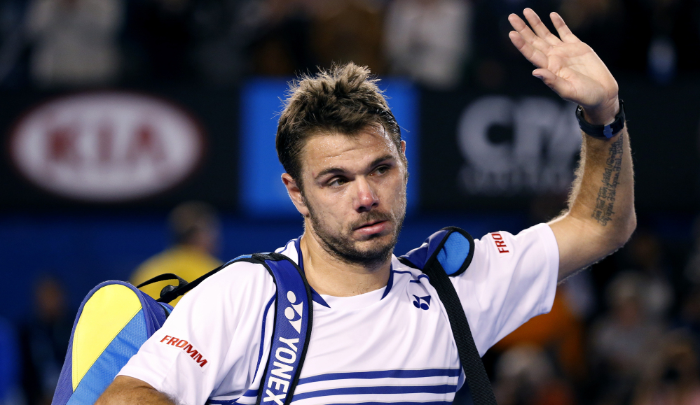 Stan Wawrinka leaves Rod Laver Arena after failing to defend his 2014 Australian Open title. Wawrinka lost in a semifinal match against Novak Djokovic, who advanced to the finals for the fifth time and will face Andy Murray.