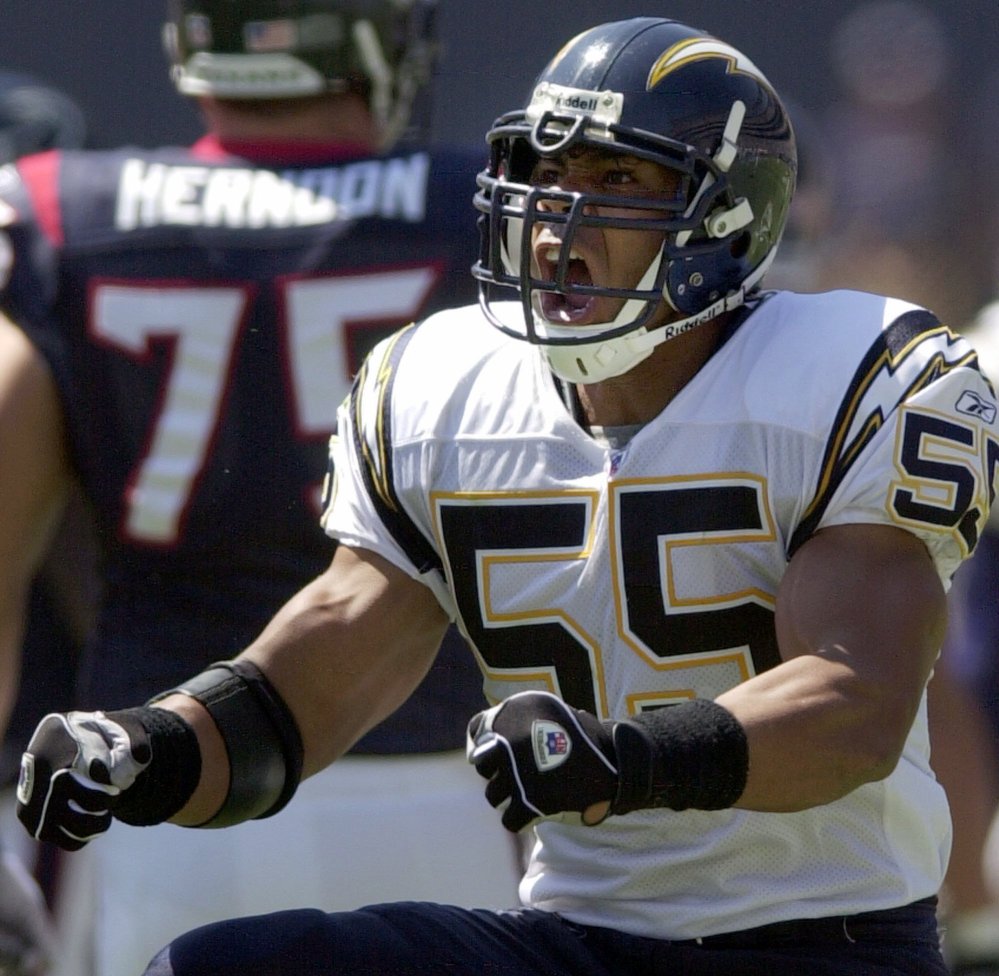 San Diego Chargers’ Junior Seau does a celebration dance after one of his seven tackles in the Chargers’ 24-3 win over the Houston Texans on Sept. 15, 2002, in San Diego.