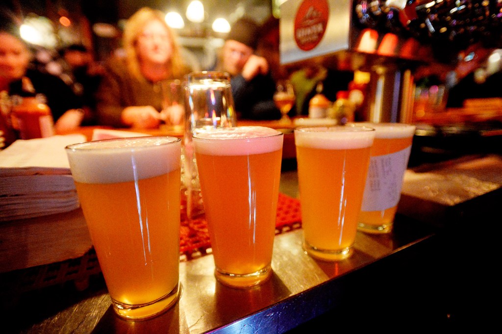 Pints of Austin Street Patina Pale Ale are lined up at the bar during the Industrial Park Challenge on Thursday at the Great Lost Bear in Portland. The beer finished second in the popularity contest.
