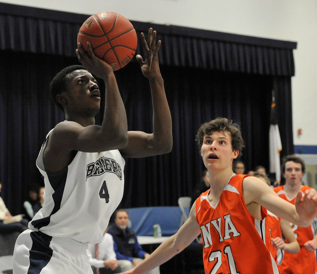 Pine Tree Academy's JP Tshamala shoots the ball in front of NYA's Jake Malcom during the Panthers' win.