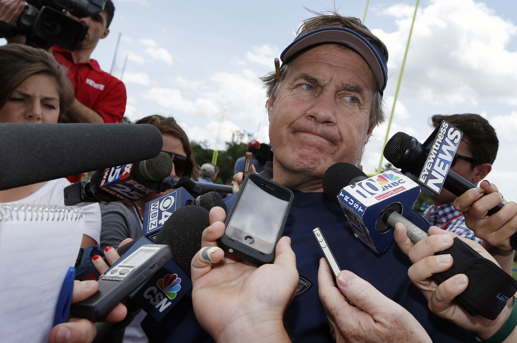 New England Patriots head coach Bill Belichick talks with reporters following NFL football minicamp in Foxborough, Mass., Wednesday, June 18, 2014.  The Associated Press