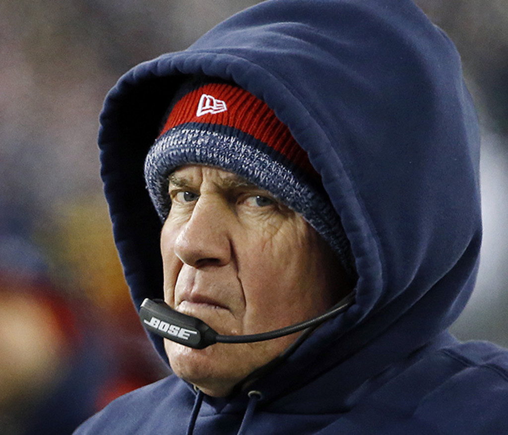 New England Patriots head coach Bill Belichick watches from the sidelines in the first half of an NFL divisional playoff football game against the Baltimore Ravens, Saturday, Jan. 10, 2015, in Foxborough, Mass. The Associated Press