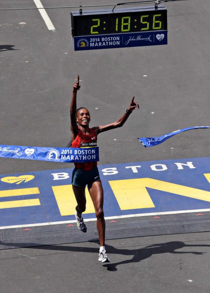 Rita Jeptoo of Kenya breaks the tape to win the women's division of the Boston Marathon in April.