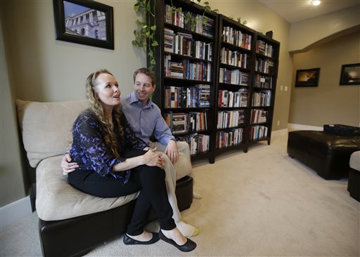 Jeff Bennion and his wife Tanya sit in their home Monday. Jeff Bennion says he's happy with his wife and their 6-year-old son. "I can't believe how lucky I am."  The Associated Press