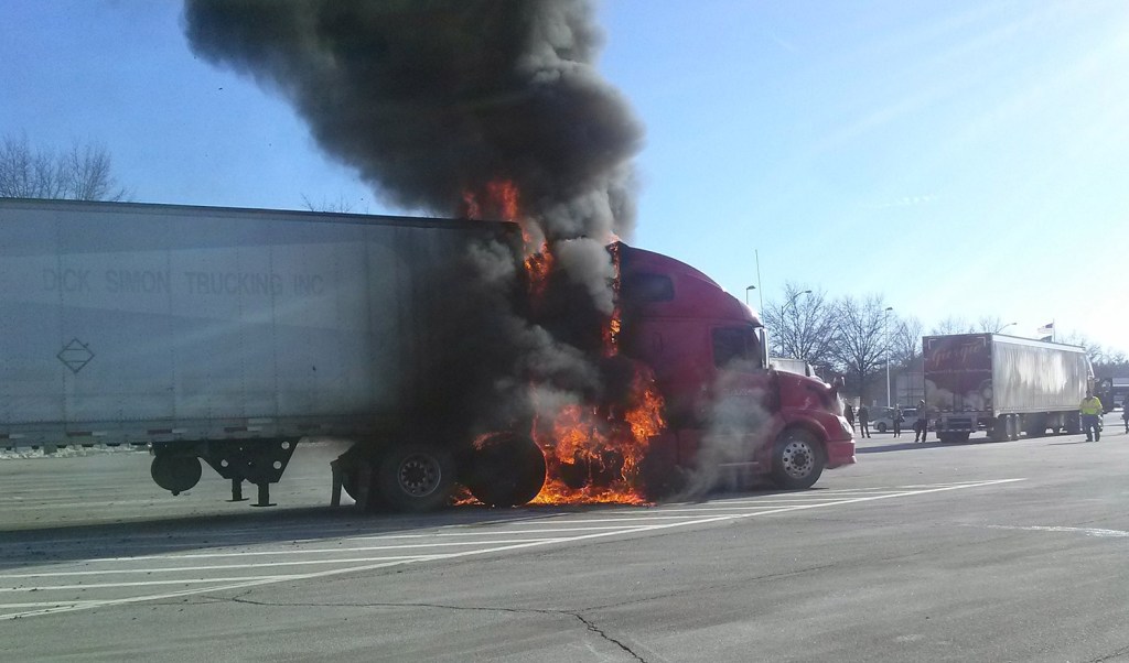 A tractor-trailer truck burns at the Kennebunk southbound service plaza on the Maine Turnpike on Friday.