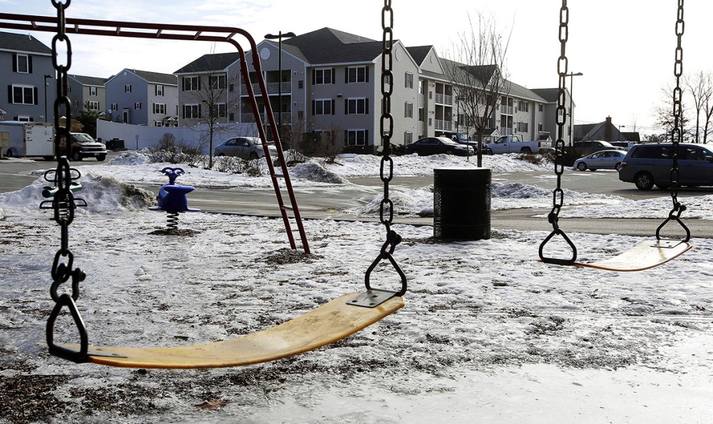 An empty playground is seen at an apartment complex Thursday in Manchester, N.H., where authorities say twin 9-year-old boys were left mostly alone for four months after their parents took three siblings to Nigeria and left an uncle to care for them. The Associated Press
