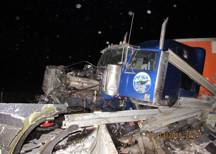 This tractor-trailer wreck closed Exit 80 on the Maine Turnpike in Lewiston Tuesday night. The wreckage was removed before Wednesday morning’s commute, but crews were expected to close the exit for more repairs Wednesday afternoon. Photo courtesy Maine Department of Public Safety