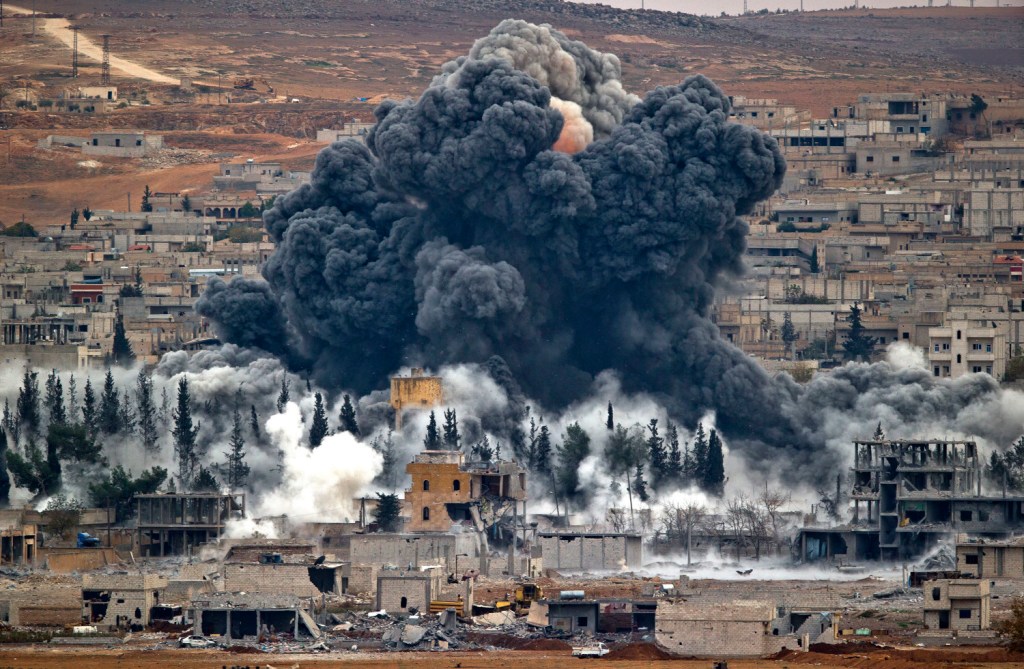 Smoke rises from the Syrian city of Kobani after an airstrike by the U.S.-led coalition in November. Kurdish fighters ousted Islamic State militants from the key border town on Monday.