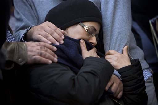 The mother of French Jew Yoav Hattab, a victim of the attack on a kosher grocery store in Paris, is comforted during his funeral procession in the city of Bnei Brak near Tel Aviv, Israel, Tuesday. The Associated Press