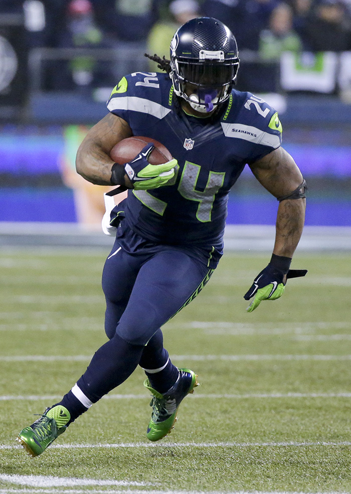 Seattle Seahawks running back Marshawn Lynch runs against the Carolina Panthers during the second half of their divisional playoff game in Seattle on Jan. 10. Lynch will be a threat both to run and catch the ball when the Patriots meet the Seahawks in the Super Bowl on Feb. 1.
The Associated Press