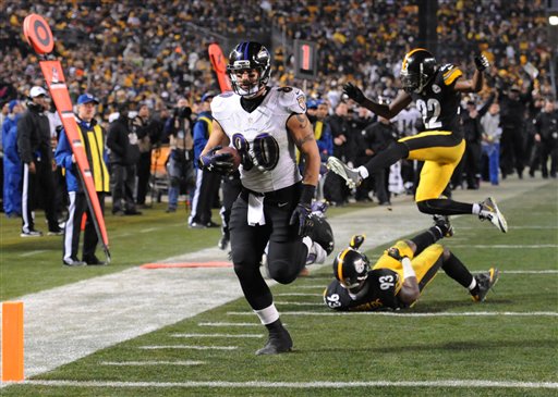 Baltimore Ravens tight end Crockett Gillmore heads for the end zone and a touchdown in the fourth quarter of Saturday's wildcard playoff game against the Pittsburgh Steelers in Pittsburgh. The Associated Press