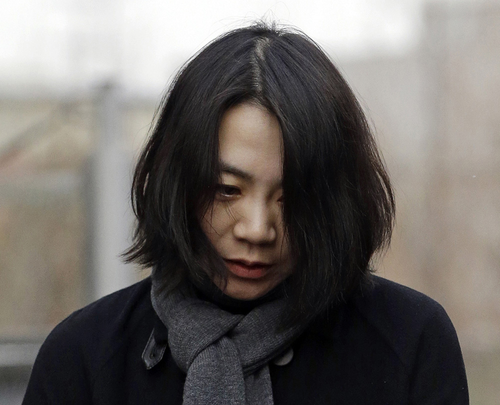 Cho Hyun-ah, who was head of cabin service at Korean Air and the oldest child of Korean Air Chairman Cho Yang-ho, is questioned by the media In this Dec. 12, 2014, photo.