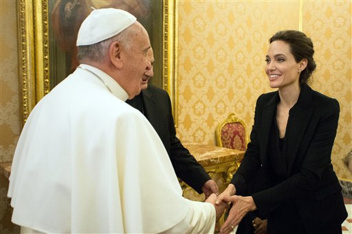 Pope Francis greets Angelina Jolie at the Vatican Thursday. The actress, director and U.N. special envoy met briefly with Pope Francis in the Apostolic Palace after screening her film "Unbroken" to some Vatican officials and ambassadors. The Associated Press