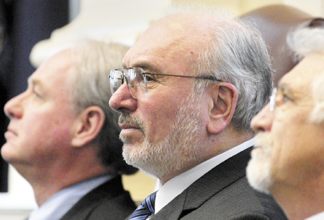 John Fitzsimmons, center, who was president of the Maine Community College System for 25 years, resigned this month after a warning from Gov. Paul LePage that the system would “feel the wrath” if he didn’t.