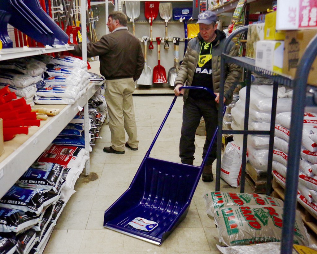 People shop for shovels Monday at Maine Hardware on St. John Street in Portland. A major snowstorm was expected to hit the area beginning late Monday evening. 