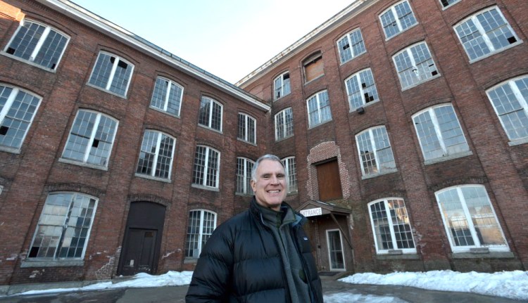 Paul Boghossian, owner and developer of the Hathaway Creative Center, stands in front of the old Marden’s and CMP building at the Hathaway complex on Wednesday. Michael G. Seamans / Morning Sentinel Staff Photographer 