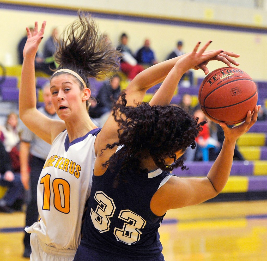 Cheverus' Jillian Libby battles for a rebound with Portland's Gabrielle Wagabaza during the Bulldogs' 67-63 girls' basketball playoff win.