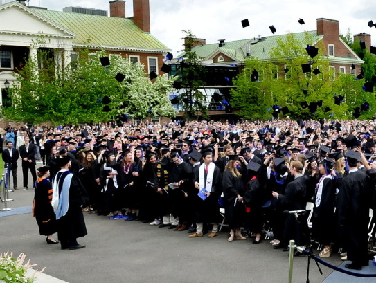 Staff file photo by David Leaming
The Colby College graduating class of 2014 signals the end of their commencement by tossing their mortarboard caps into the air. The college has had a 47 percent hike in applications this year.