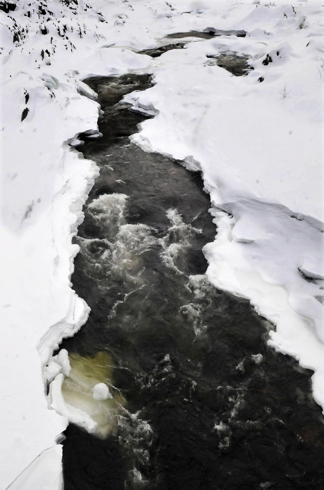 A combination of high water, melting snow and ice jams could lead to flooding this spring near where the Carrabassett River, pictured in Anson, flows into the Kennebec River in Madison.