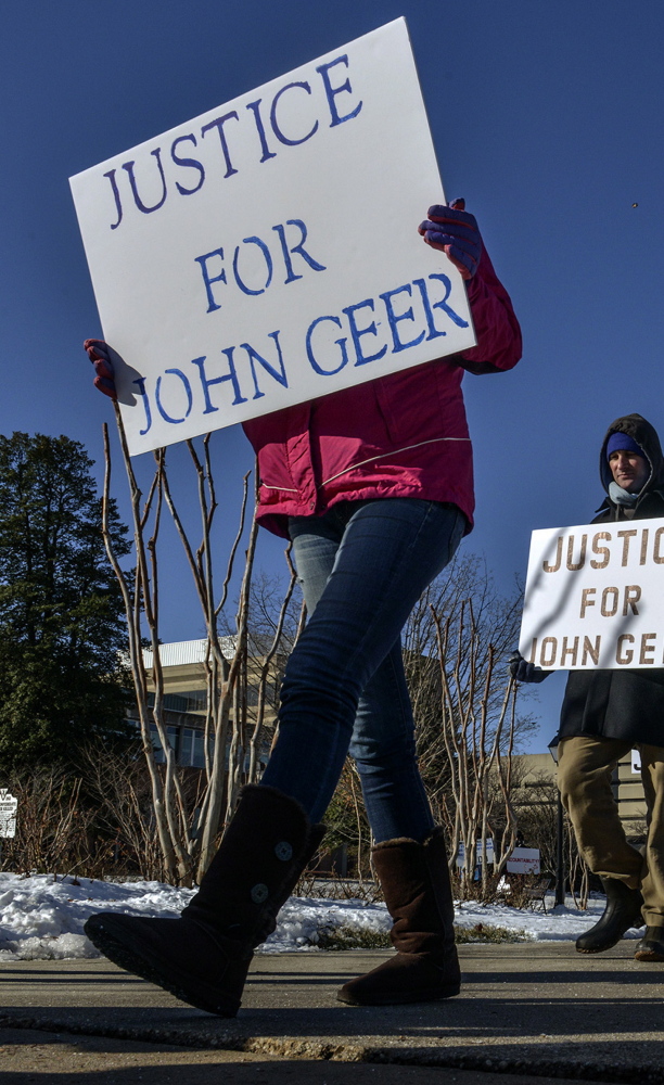 A group called “Justice for John Geer” pickets outside the Fairfax County police department on Jan. 8. A federal investigation of the police department’s shooting of Geer is underway. 