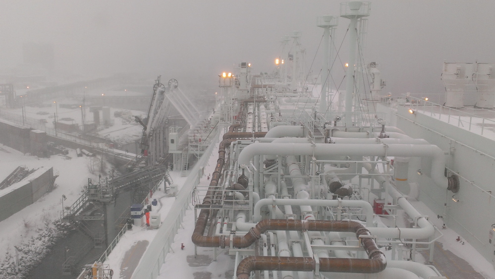 Seen from aboard ship, the LNG carrier GDF Suez Neptune is docked during last Tuesday’s blizzard at the GDF Suez marine terminal in Everett, Mass. The liquefied natural gas it unloaded last week is expected to help shore up tight supplies in New England during cold weather in the next few weeks.