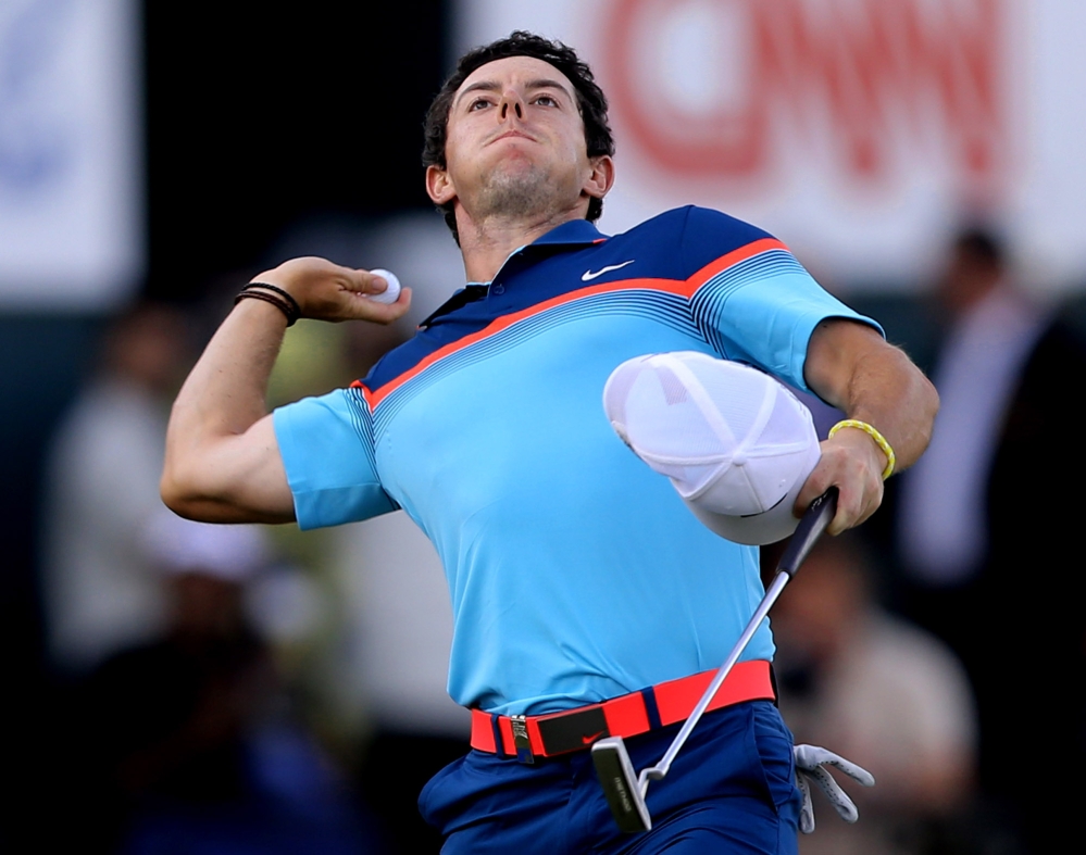 Rory McIlroy throws his ball to the crowd after he wins the Dubai Desert Classic golf tournament in United Arab Emirates on Sunday.