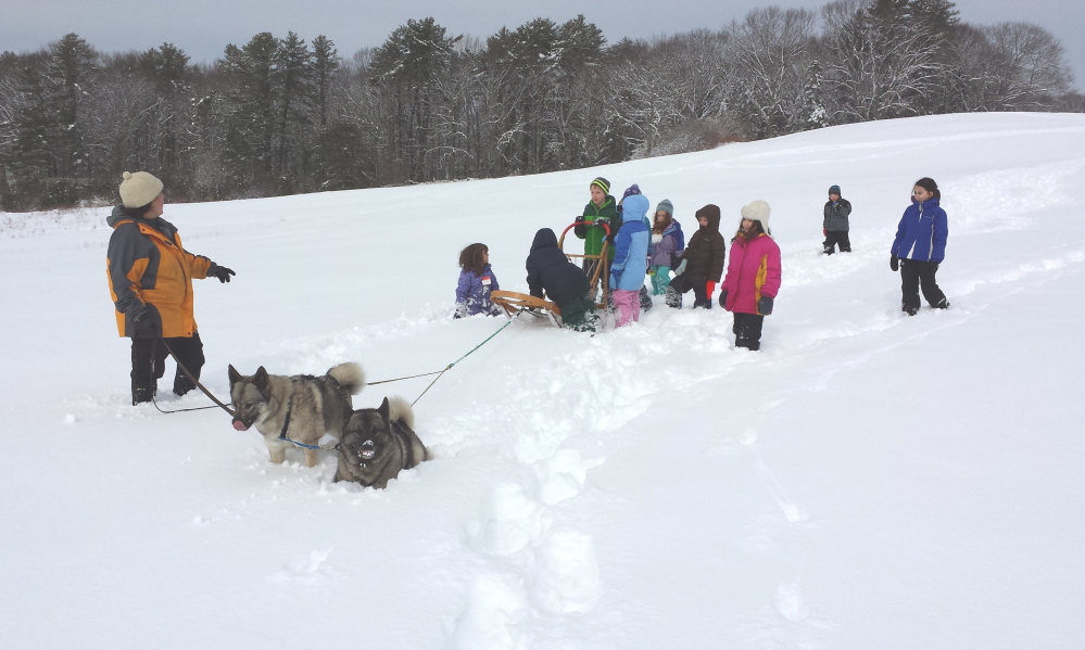 Dog sledding and other outdoor activities for children will be part of a school vacation day camp offered by the Damariscotta River Association. Registration is due by Feb. 9.