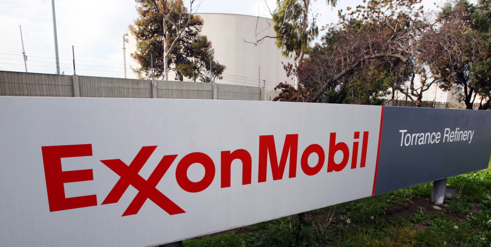 Exxon Mobil on Monday posted a 21 percent decline in profit and revenue for the fourth quarter because of lower oil prices.