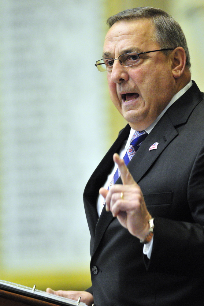 Gov. Paul LePage makes a point during the State of the State address Tuesday before a joint convention of the Legislature assembled in the House chamber at the State House in Augusta. (Joe Phelan/Kennebec Journal)