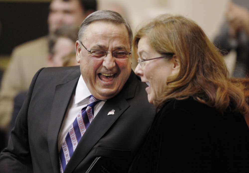 Gov. Paul LePage shares a laugh with Maine Chief Justice Leigh Saufley following his State of the State address (The Associated Press/Joel Page)