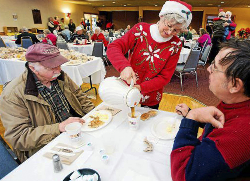 Connie Howe pours coffee for Ronald Read, left, and Dave Smith during a holiday breakfast in December 2011 at the American Legion in Brattleboro, Vt. Before Read bequeathed $6 million to the town’s hospital and library, no one knew he was wealthy.