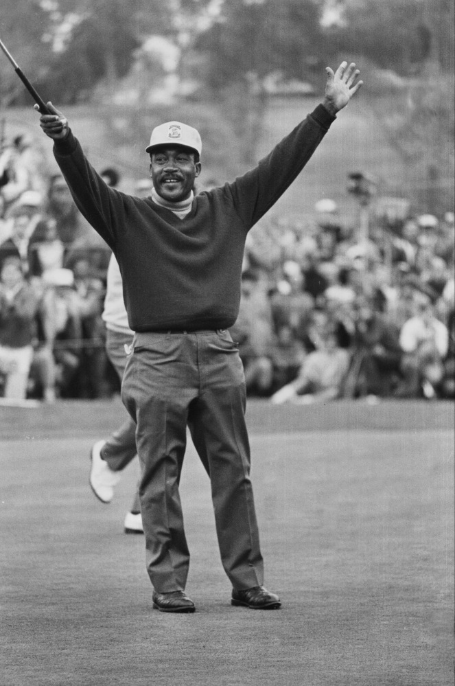 Charlie Sifford throws up his arms after sinking a short par putt on the 18th green to tie Harold Henning at the end of 72 holes in the 1969 Los Angeles Open. Sifford, who fought the Caucasian-only clause on the PGA Tour and became its first black member died, Tuesday at the age of 92.