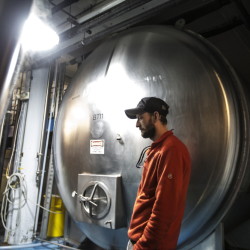 Rob Griffin waits for a beer tank to rinse at Shipyard Brewery Co. in Portland on Wednesday. The Maine Legislature could soon make it easier for new brewers to break into the state’s growing craft beer market. A bill requested by Shipyard would allow large breweries with excess production capacity to form tenant agreements with as many as nine smaller beer companies to lease brewing time on their equipment. Right now, large brewers can host only one tenant brewery. Whitney Hayward/Staff Photographer